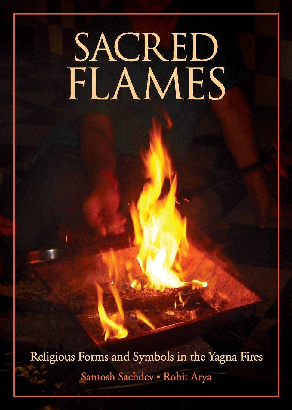 Front cover of the book 'Sacred Flames' by Arya Rohit.