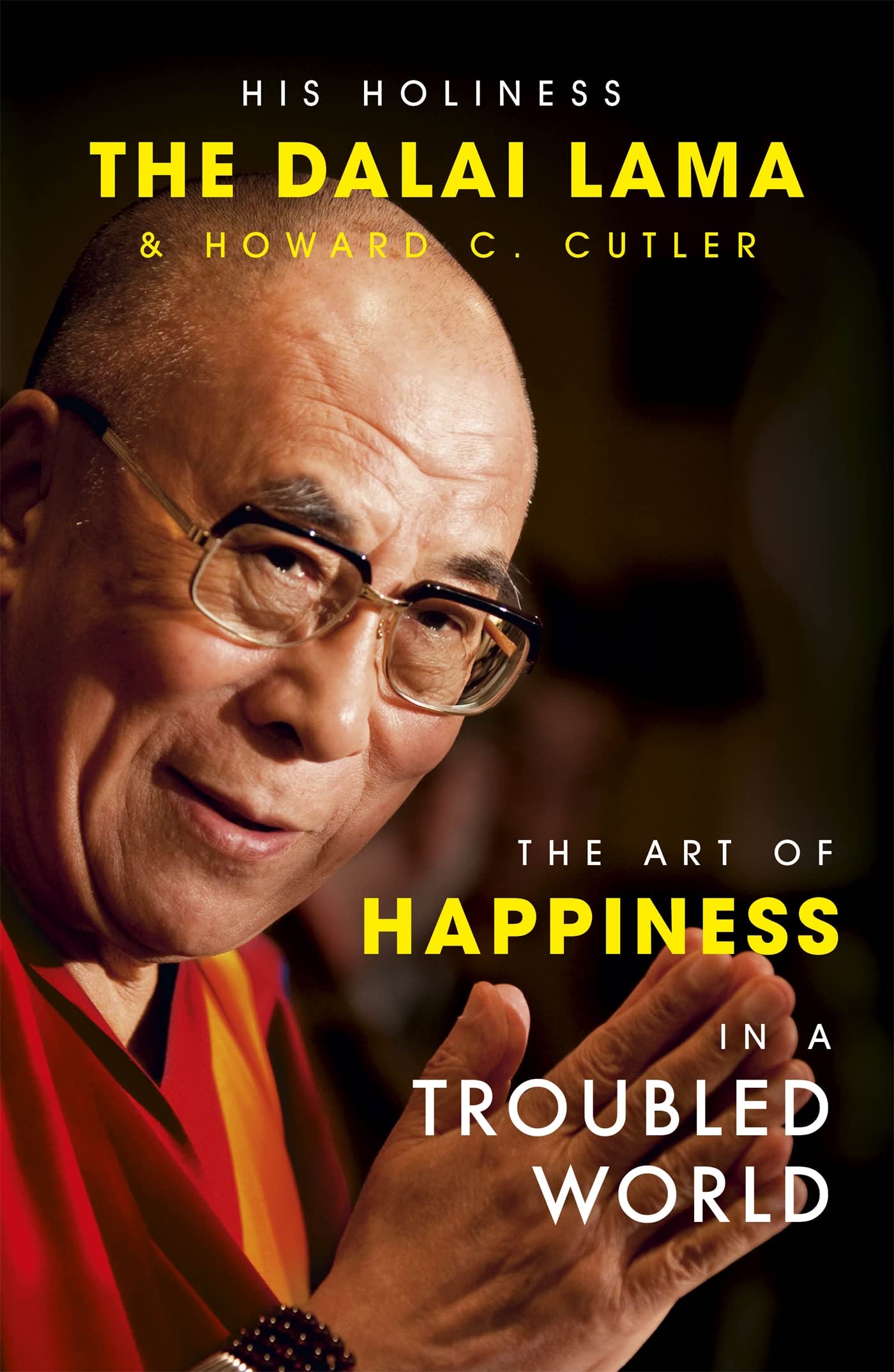 Front cover of the book 'The Art of Happiness in a Troubled World' by His Holiness The Dalai Lama & Howard Cutler.