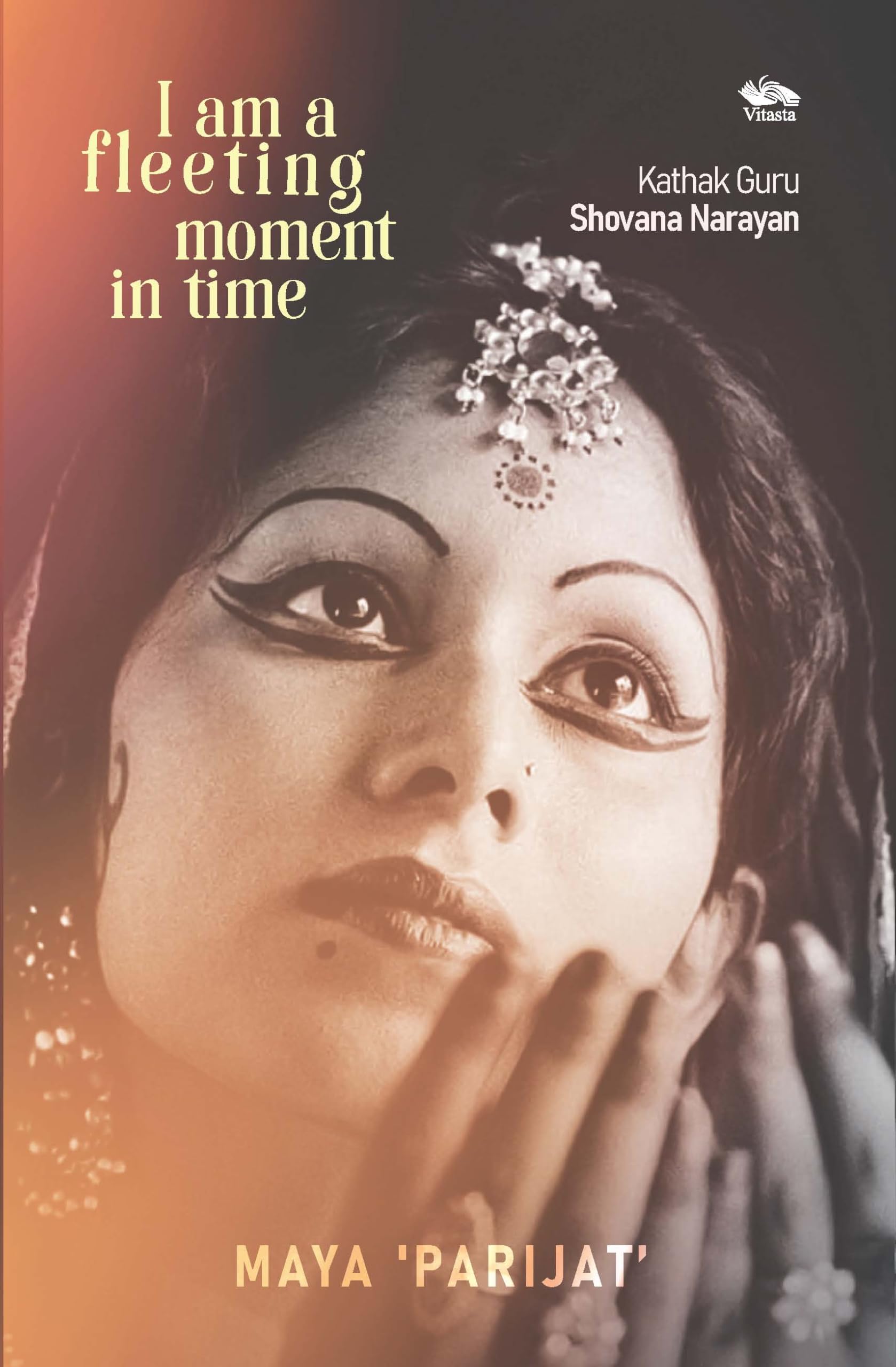 Front cover of the book 'I am a fleeting moment in time: Kathak Guru Shovana Narayan' by Dr Maya Parijat.