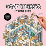Front cover of the book 'Cozy Stickers: My Little Shops: 5 scenes to create with 500 mini stickers' by Alain Boyer.
