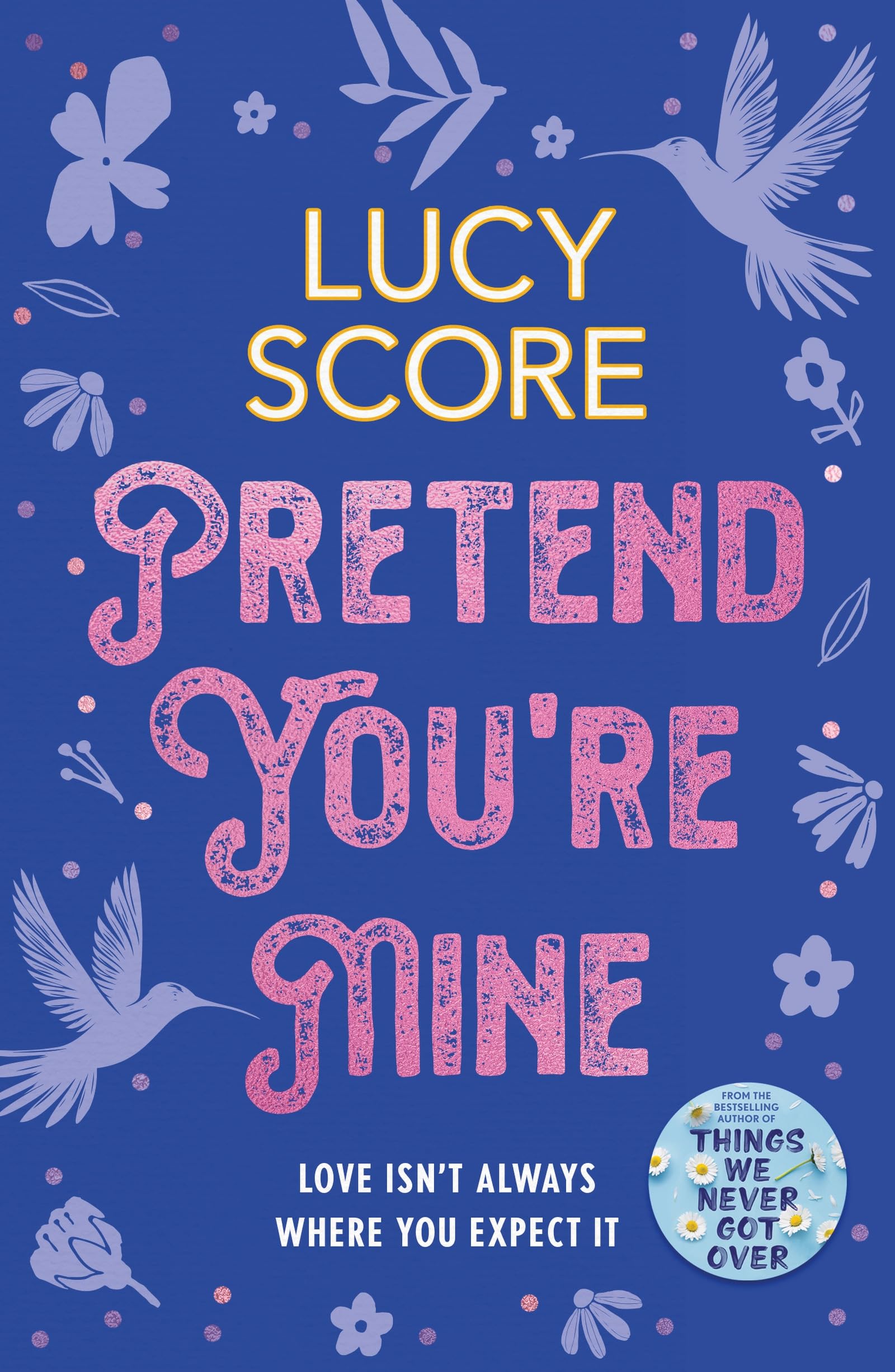 Front cover of the book 'Pretend You're Mine: a fake dating small town love story from the author of Things We Never Got Over (The Benevolence Se' by Lucy Score.