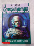 Front cover of the book 'The Curse Of The Mummys Tomb' by R.l Stine.