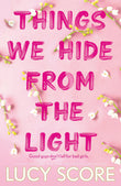 Front cover of the book 'Things We Hide From The Light' by Lucy Score.