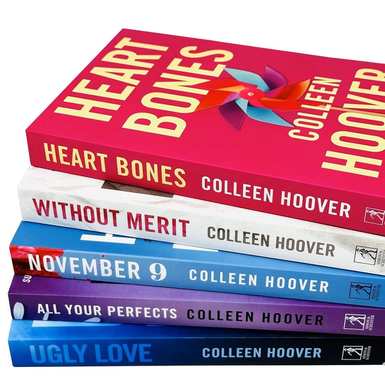 Stack of books by Colleen Hoover with colorful covers on a white background